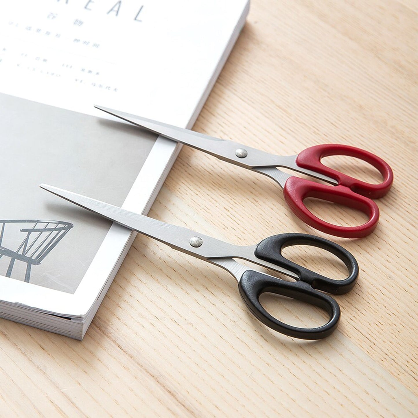 Top-down view of all-purpose stainless steel scissors with durable plastic handle.