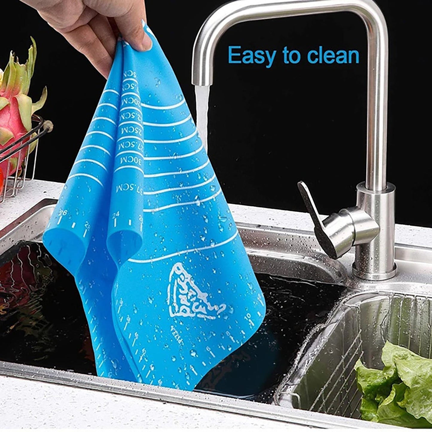 Flexible silicone rolling mat laid flat on a kitchen countertop for dough preparation.