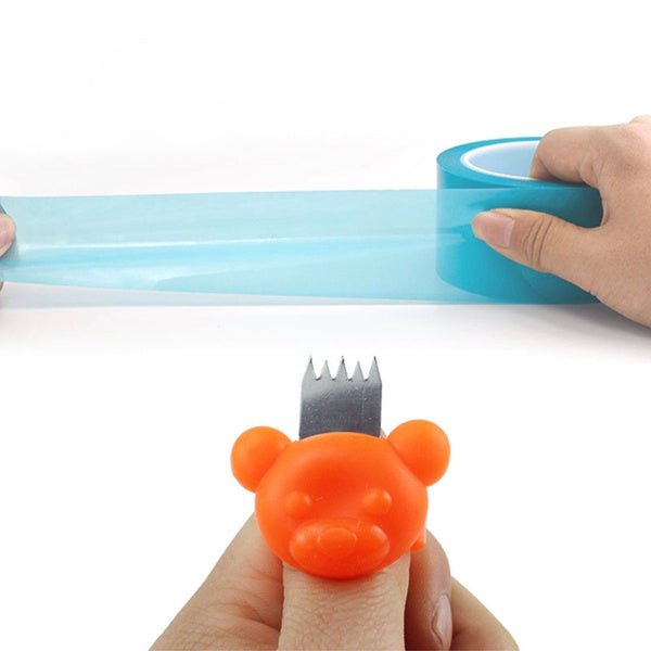 Close-up view of the ergonomic Finger Tape Cutter in action.