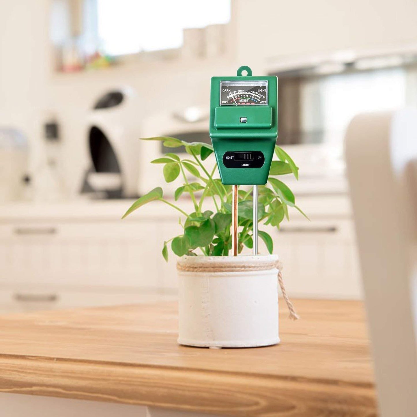 Detailed view of the soil pH meter's long probe, ready for testing garden soil.