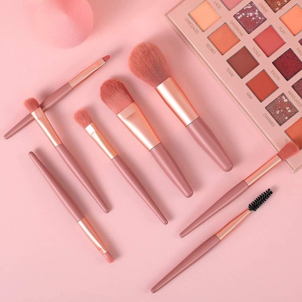An 8-piece mini makeup brush set with a light pink handle and synthetic bristles, arranged neatly.