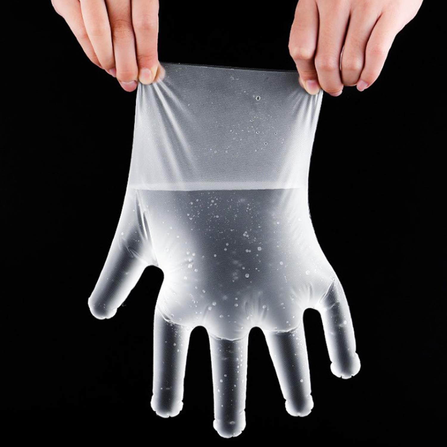 Retail packaging of 100-piece disposable clear gloves, ready for sale.