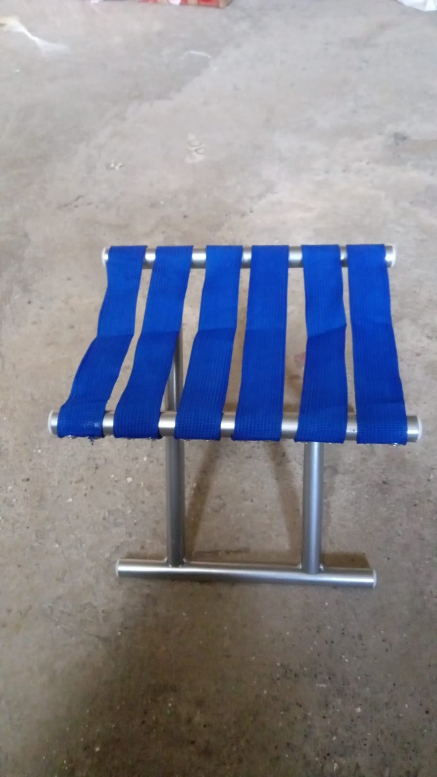 The versatile camping stool set up at a campsite, providing a convenient and comfortable seating option.