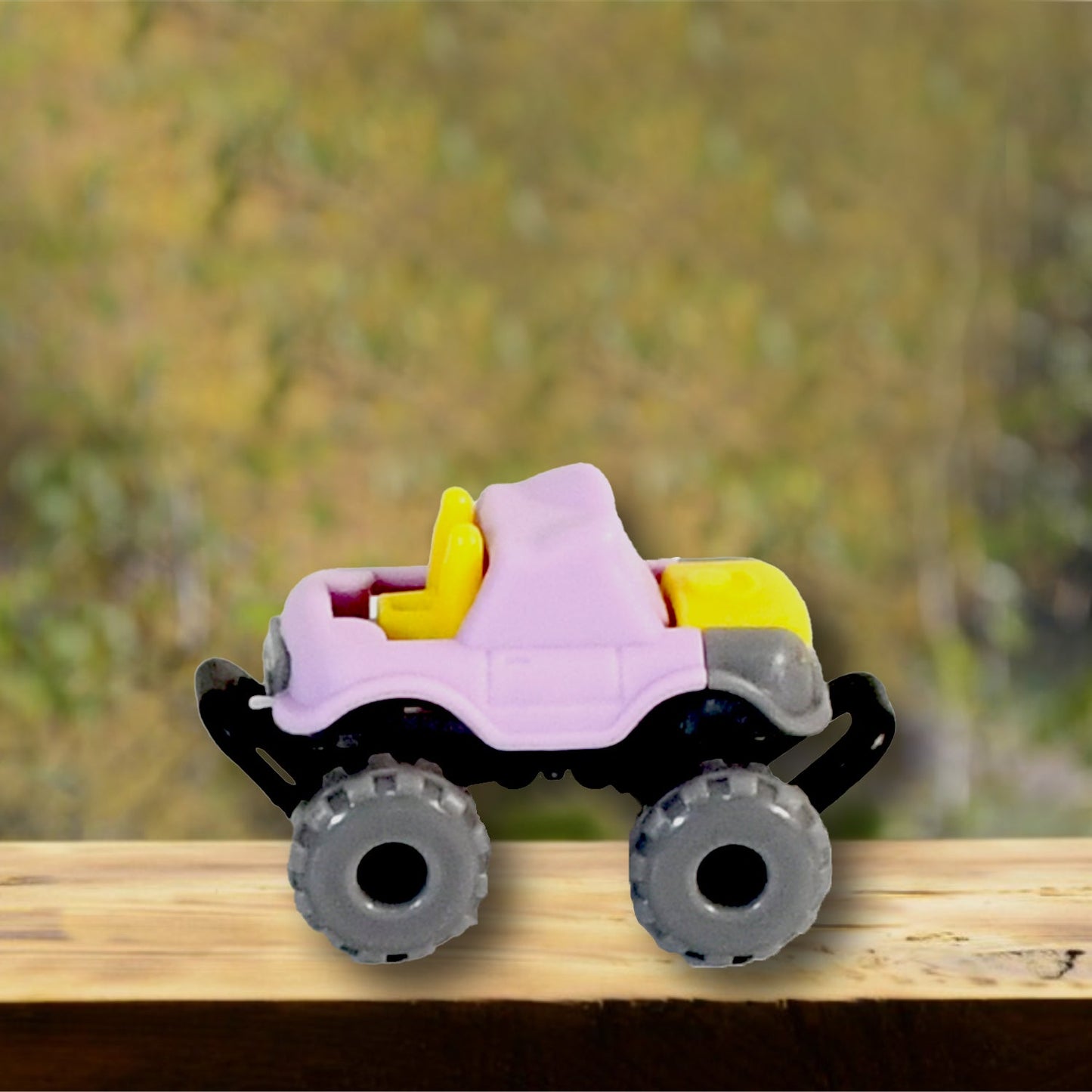 Different coloured friction powered monster trucks arranged to show the variety in the 30 Pcs Set.