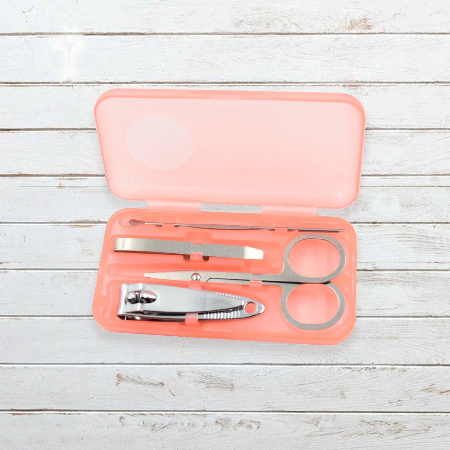 AuriGlam portable nail clipper set in its clear plastic travel case.