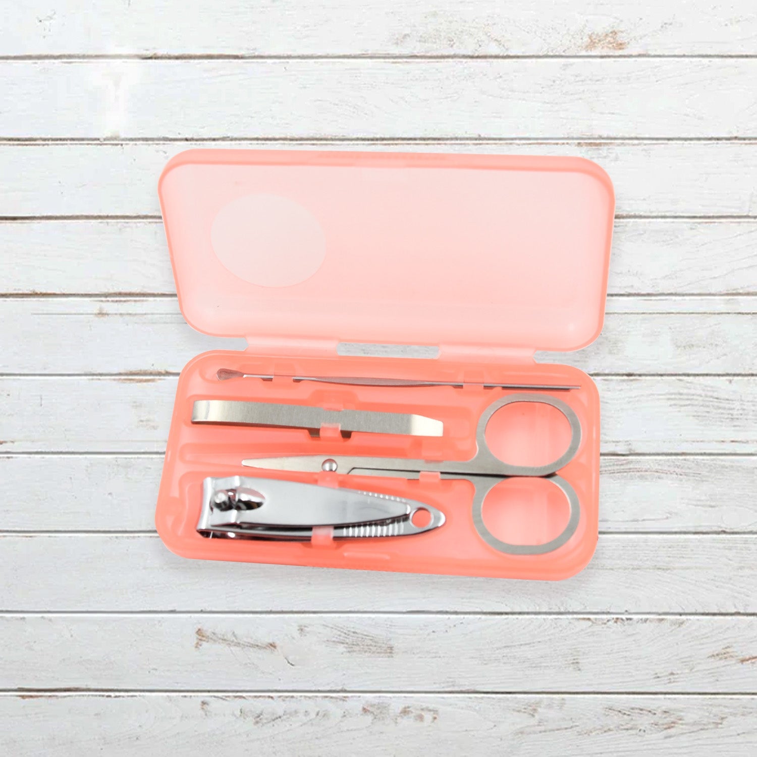 AuriGlam portable nail clipper set in its clear plastic travel case.