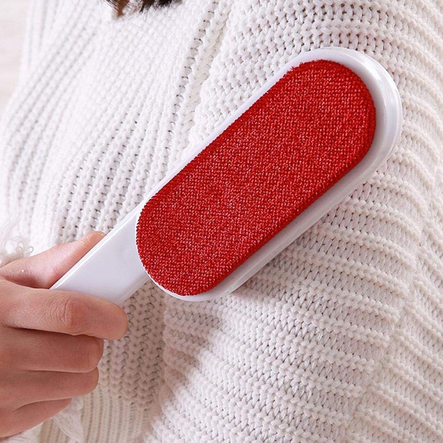 Self-cleaning base of the pet hair removal tool, collecting trapped fur.