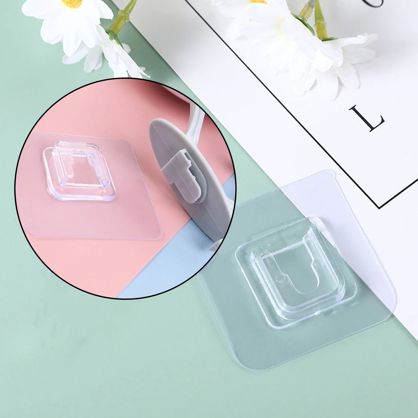 Lifestyle image of a waterproof self adhesive wall hook organizing items in a bathroom.
