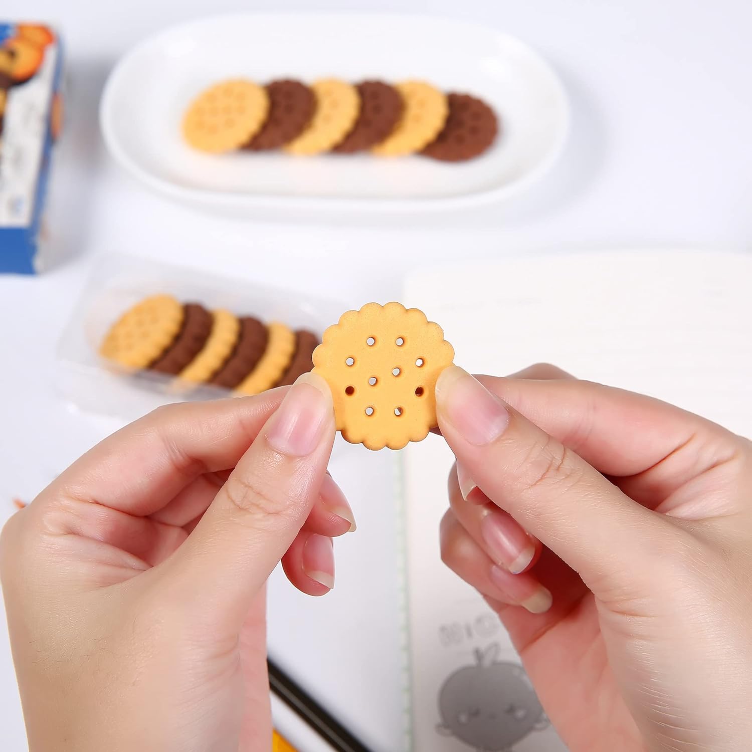 Realistic biscuit erasers lined up in a row, emphasizing their playful appearance.
