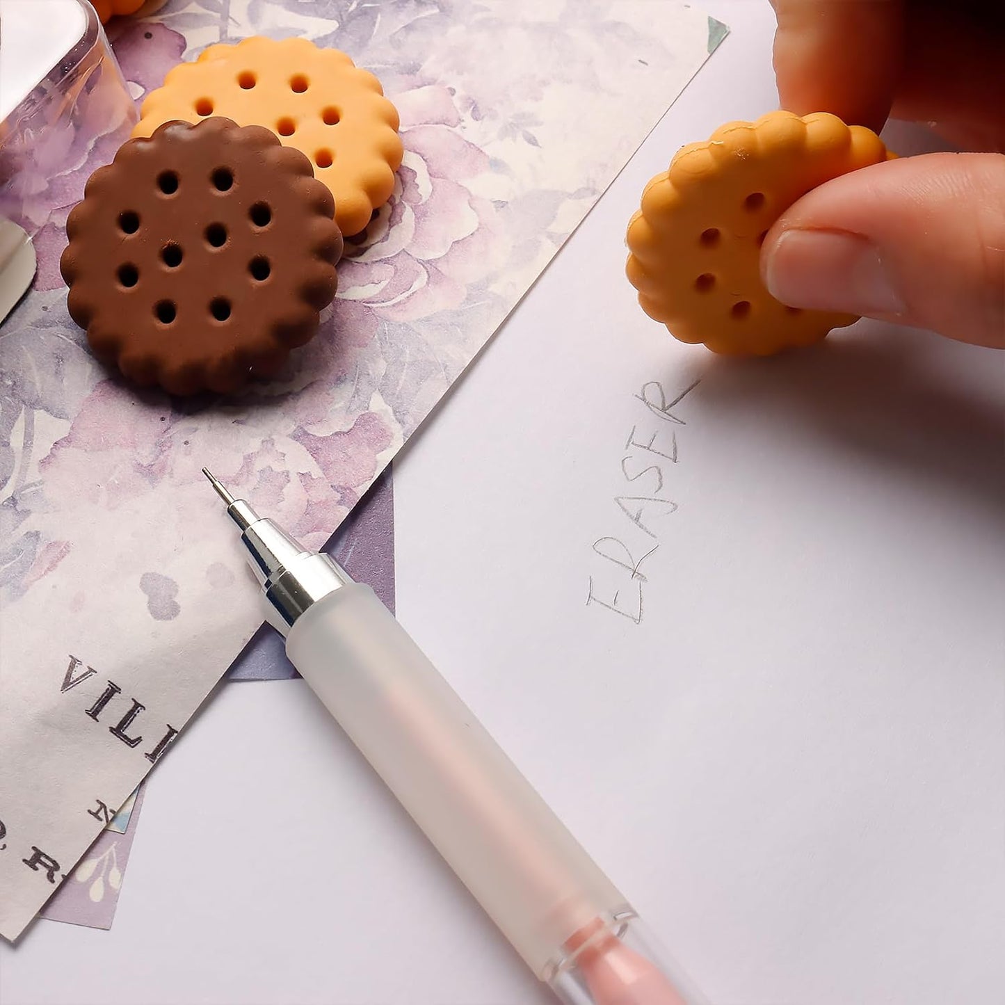 Set of 6 biscuit-shaped erasers in a clear display box, perfect for kids' stationery.