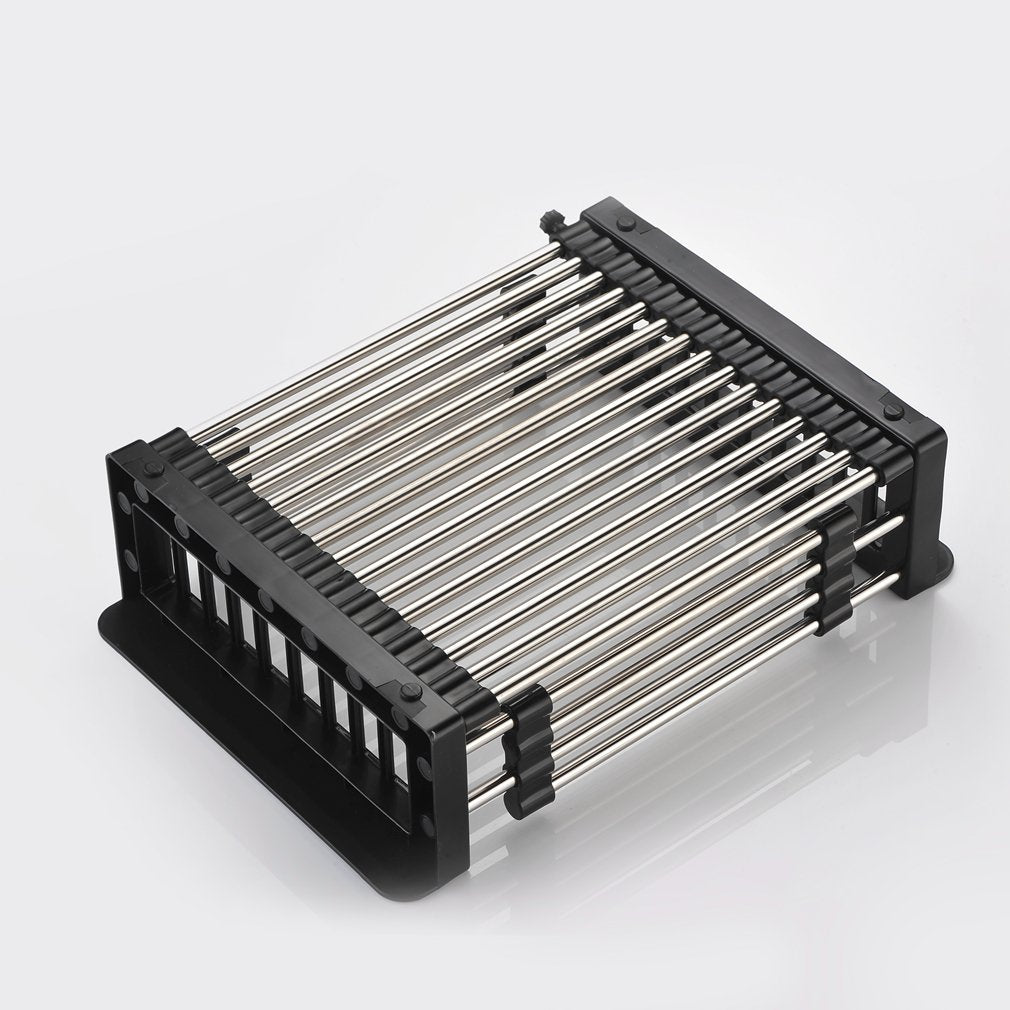 Stainless steel dish drainer holding plates and cups, demonstrating its capacity.