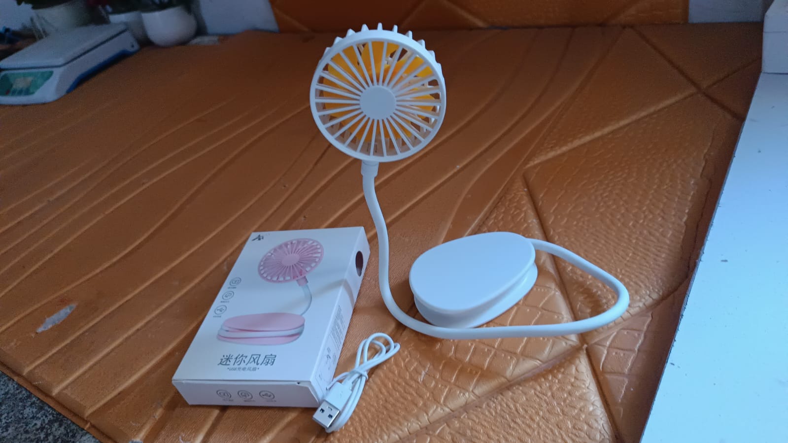 Mini USB Fan held in hand showcasing compactness