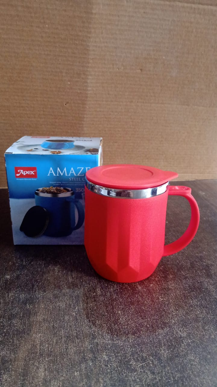 Person enjoying a hot beverage from the Apex insulated mug at an office desk.