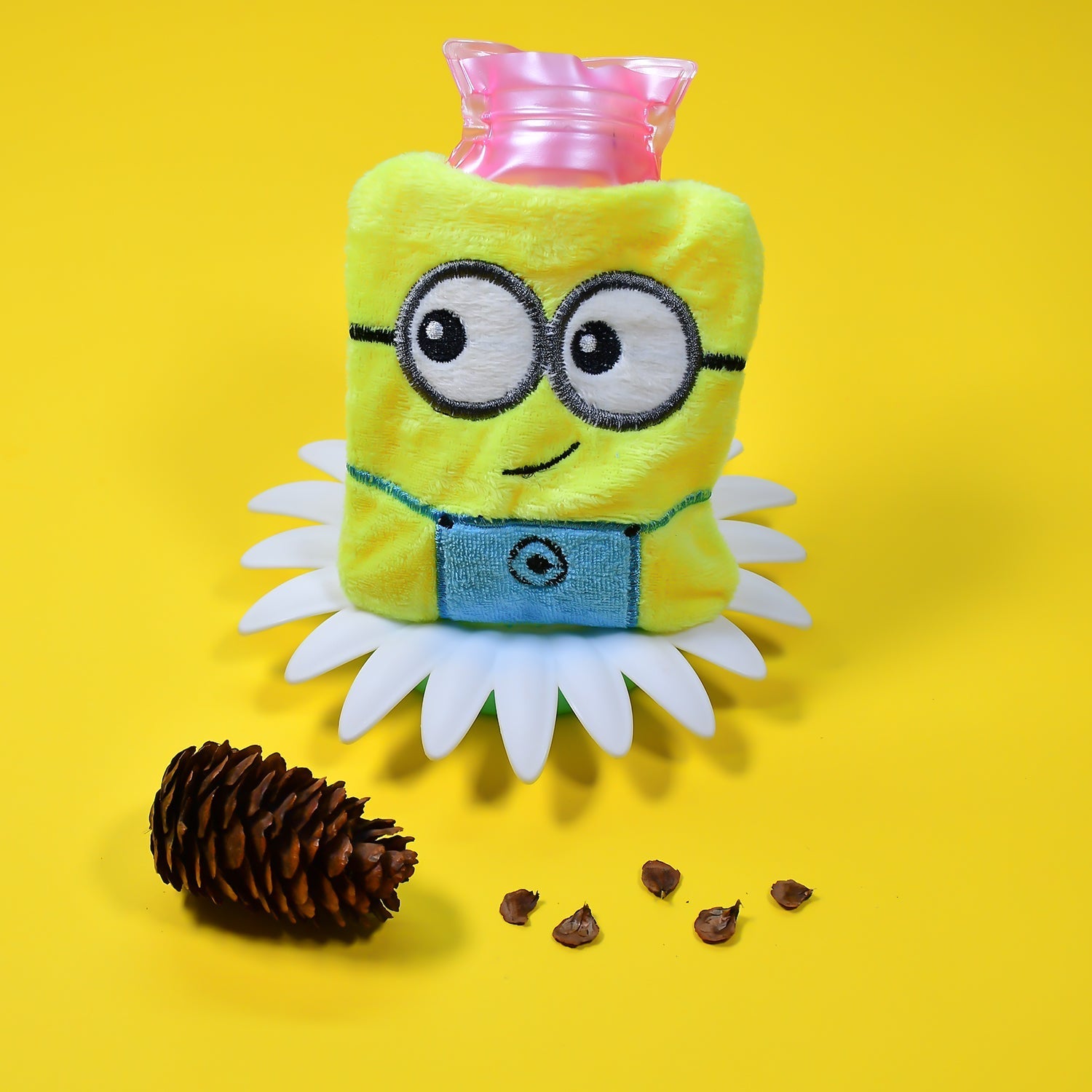Cute Minions 2-eye hot water bag with soft yellow cover for pain relief.