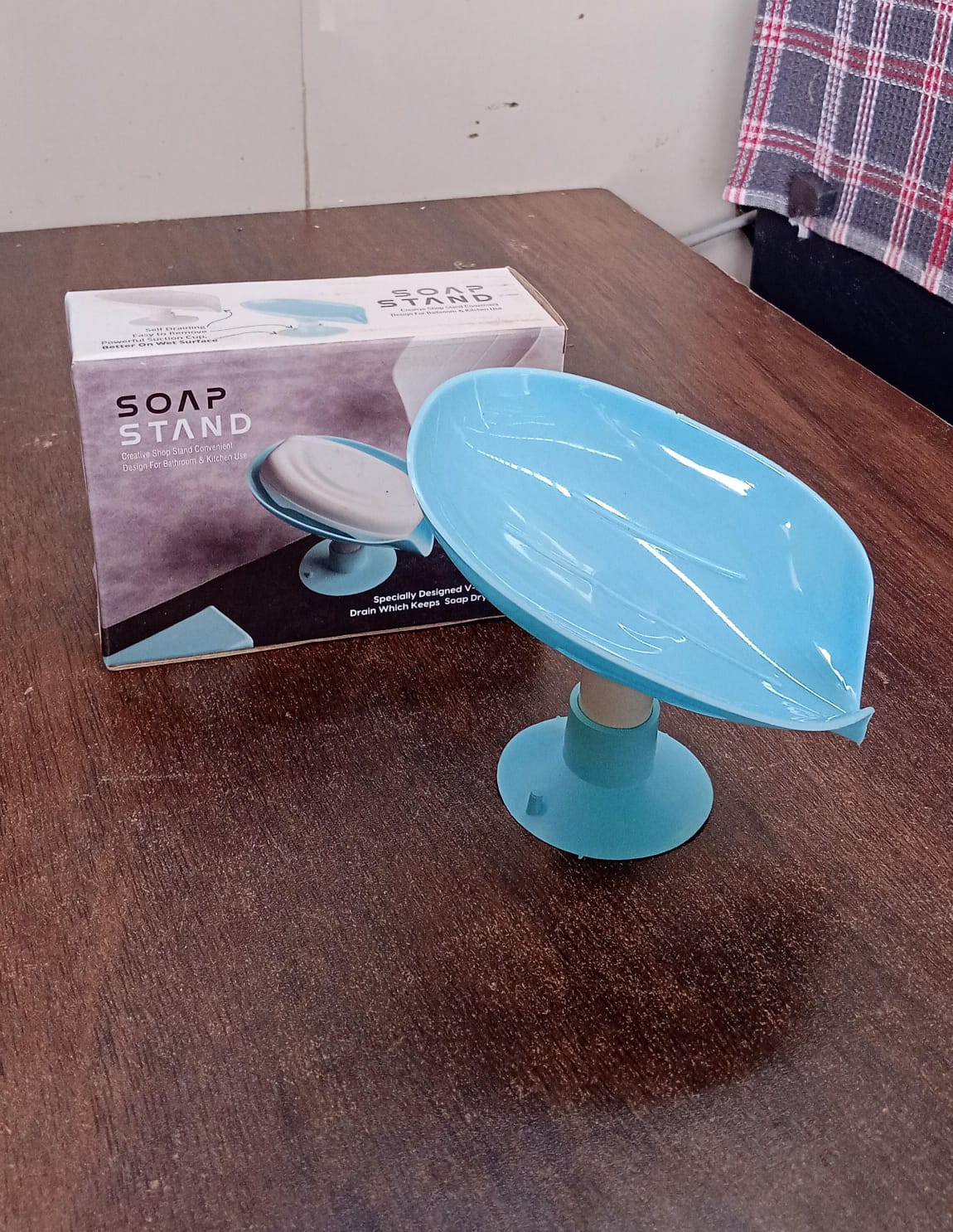 Self draining soap dish in active use, keeping soap dry.