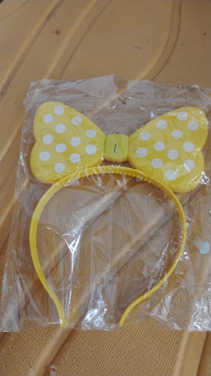 LED polka dot bow hairband displayed upright for kids' use
