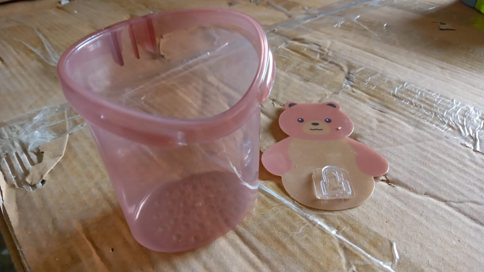Multipurpose teddy bear wall mount holder, perfect for kids' dental hygiene items.