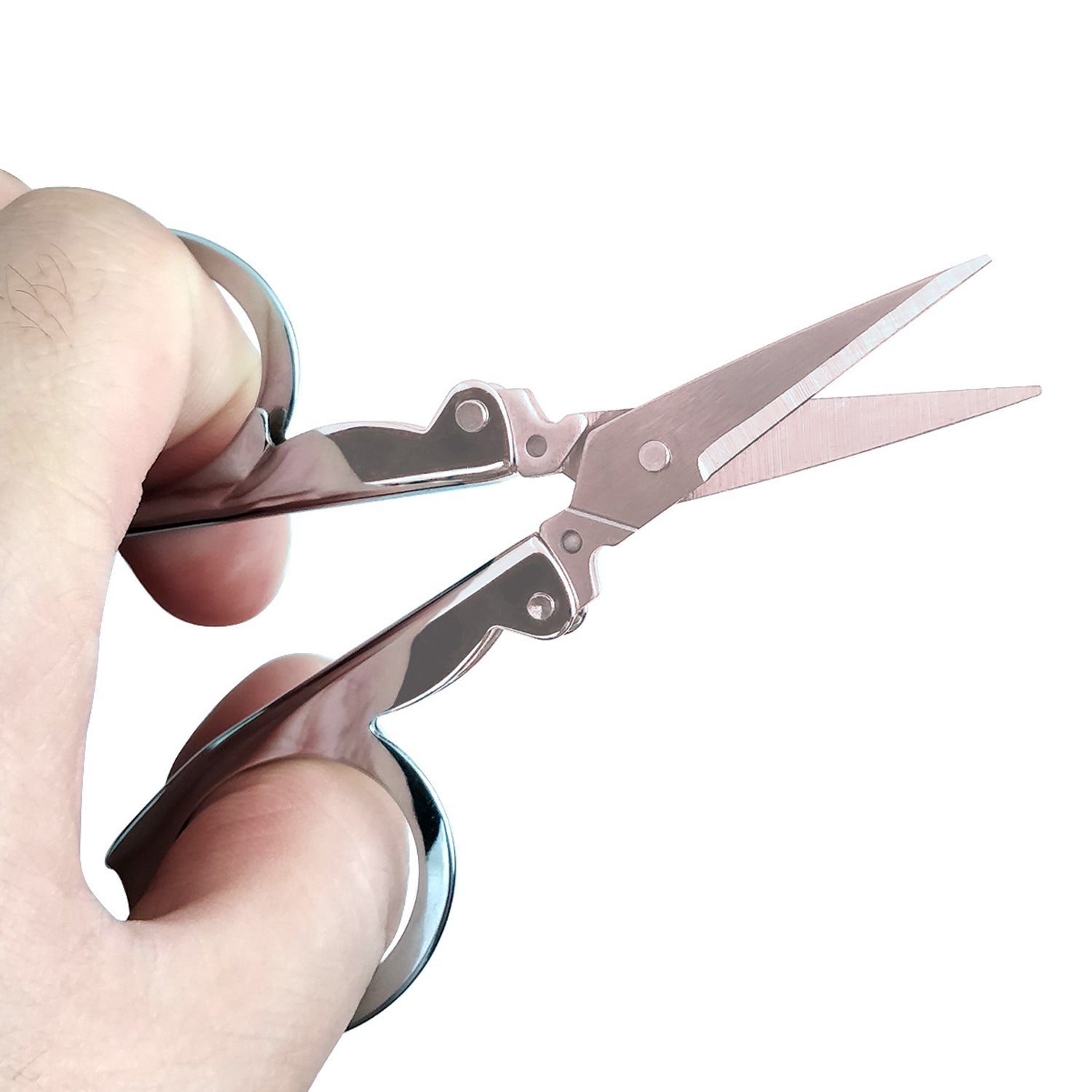 Ergonomic stainless steel folding scissor in a compact design.