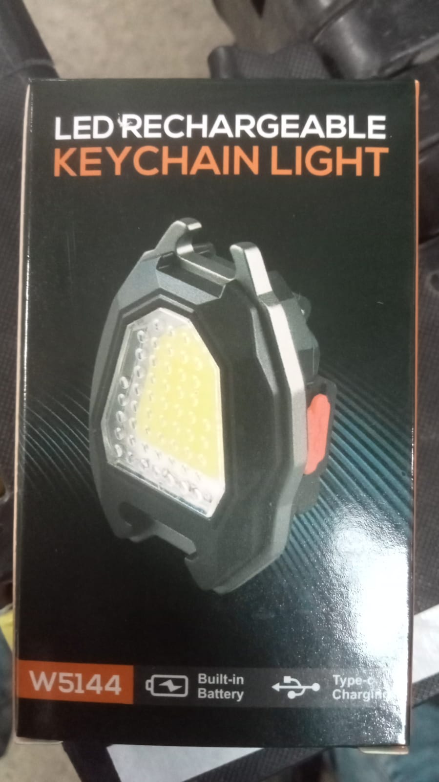 Triangular camping flashlight demonstrating its efficient built-in lighter function.