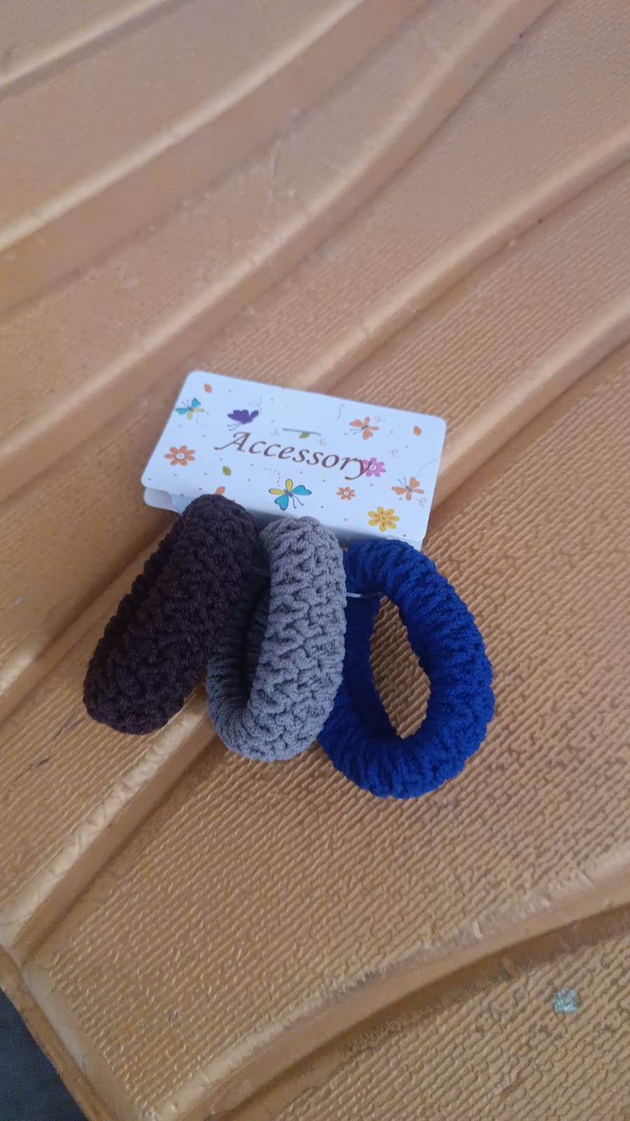 Packaged set of multicolour tyre shape hair bands from Calm & Curl.