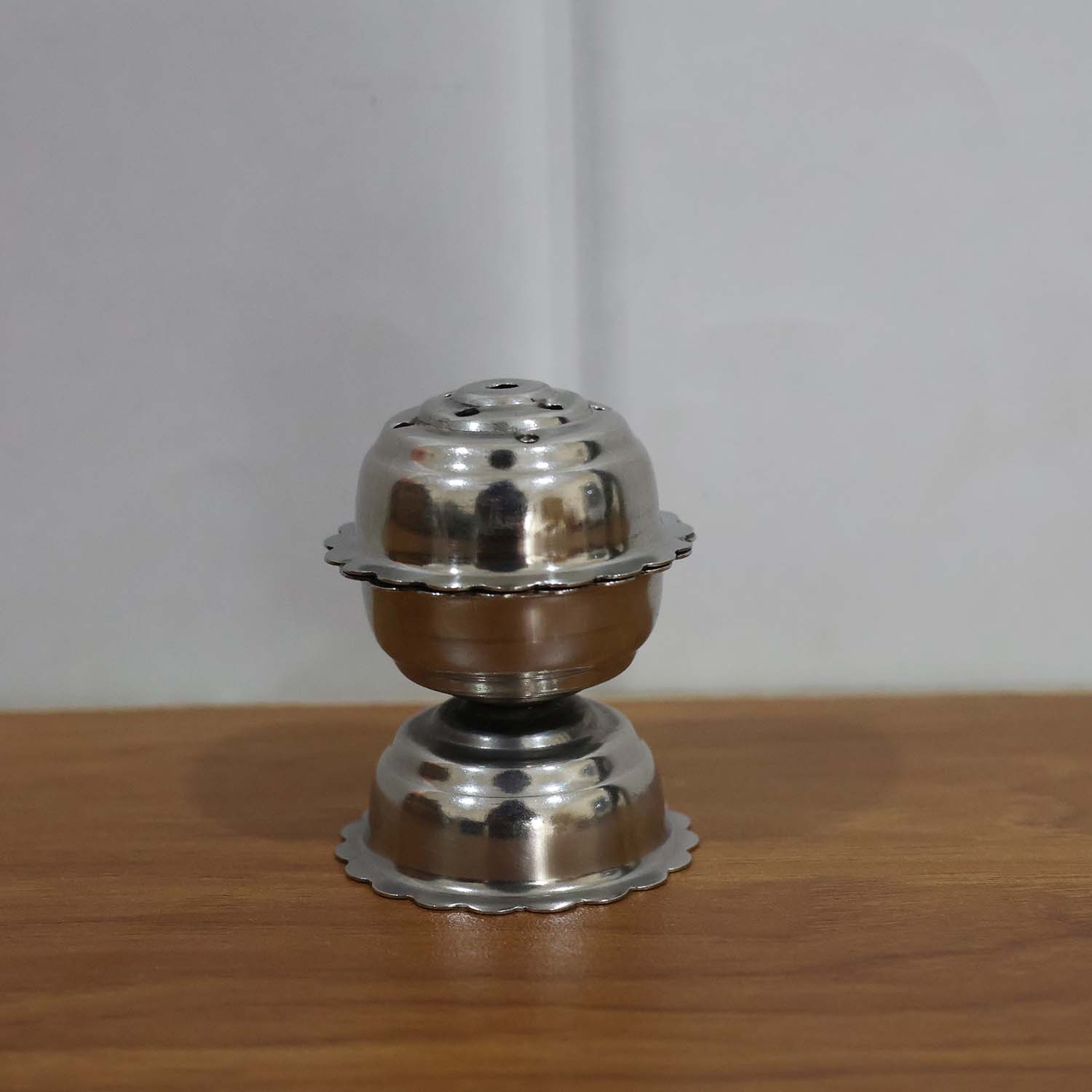 Agarbatti burning in a Lotus incense holder, creating a serene ambiance.
