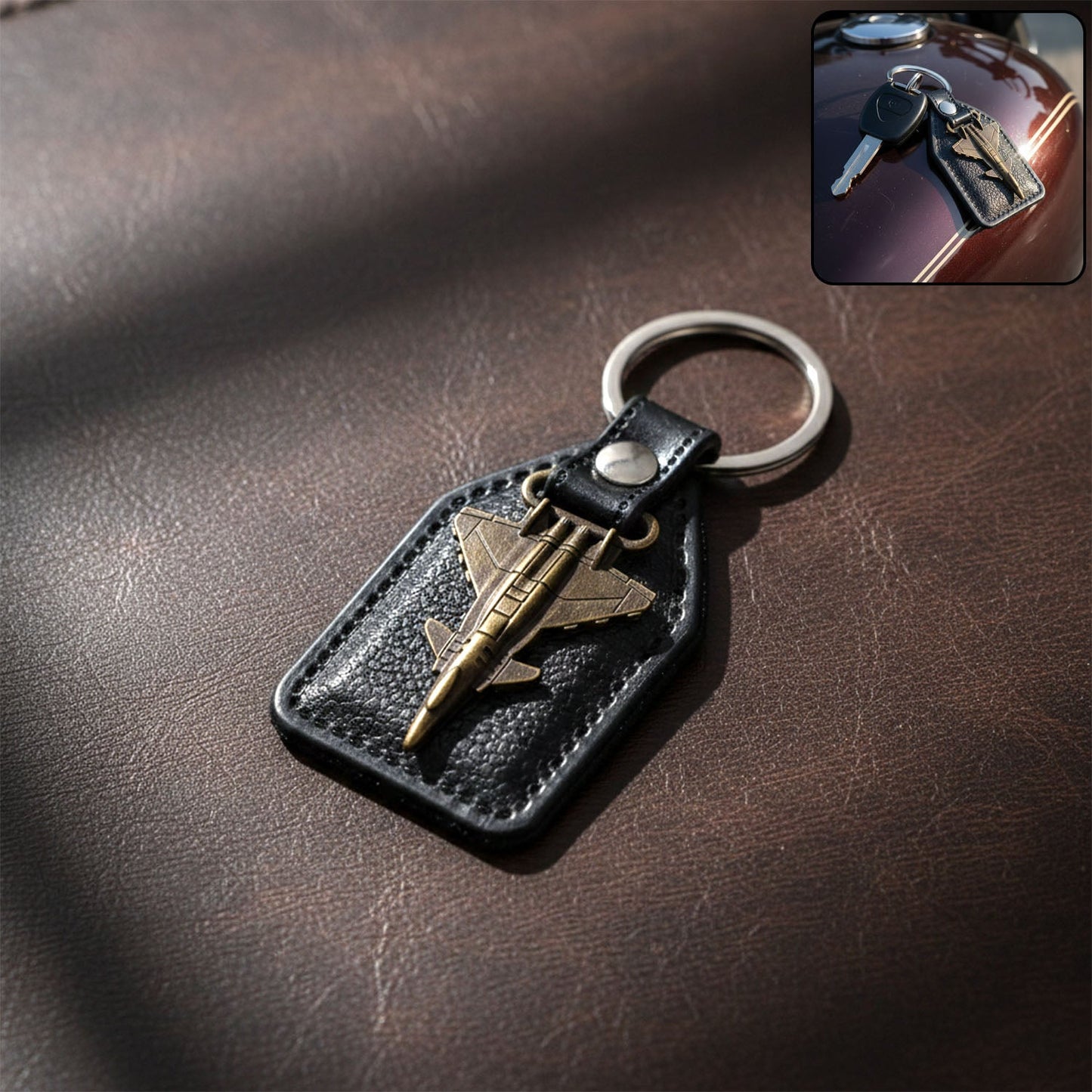 Aircraft design metal keychain with fighter jet emblem on leather-finish base