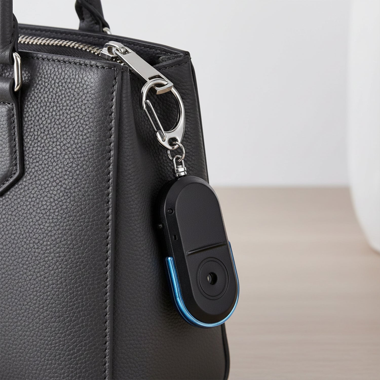 Durable emergency alarm keychain with quick activation feature