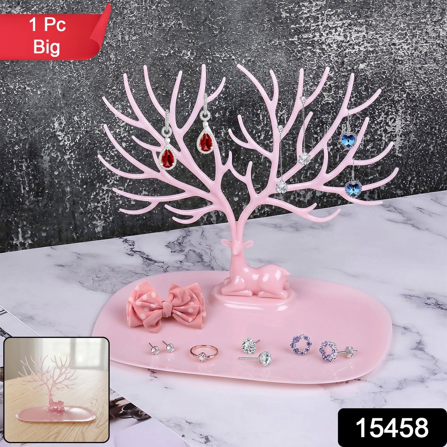 Side view of large pink deer jewelry stand with tree-shaped branches, India