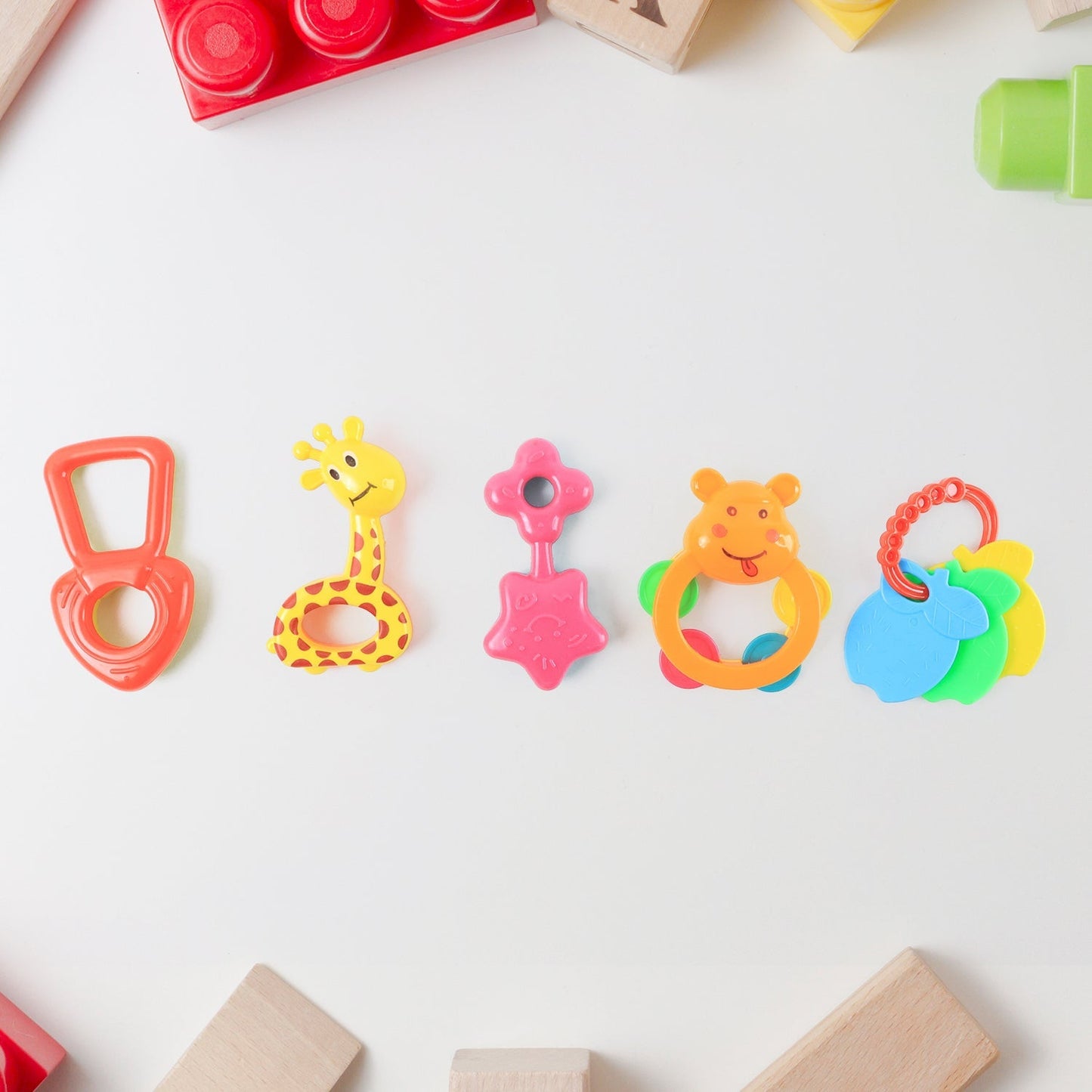 Baby rattle toy featuring friendly animal face for infant play