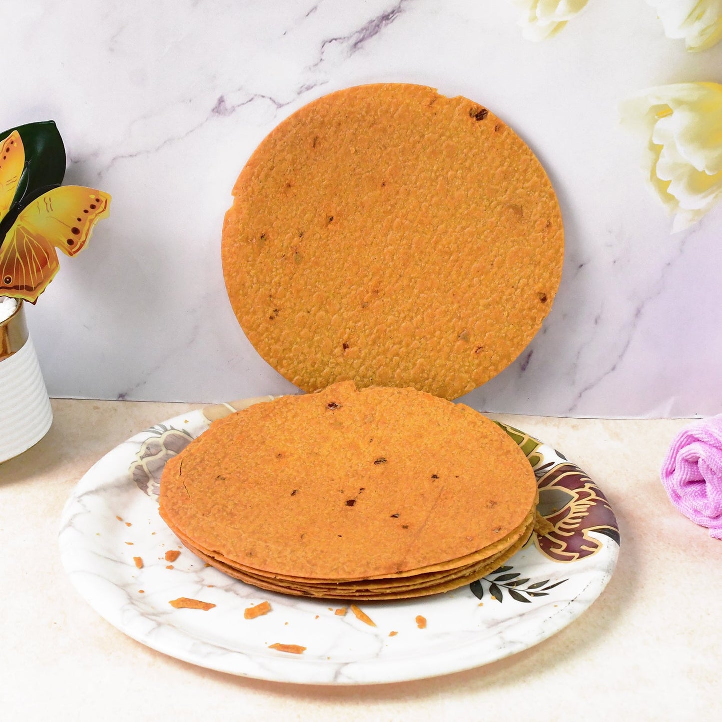 Close-up shot of a thin, crunchy Maniarr's Bajri Khakhra, perfect for snacking.