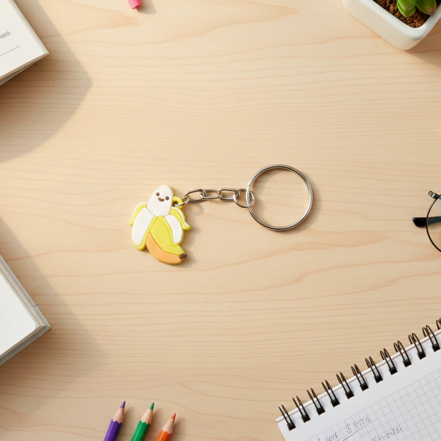 Playful banana cartoon keychain hanging from backpack zipper pull
