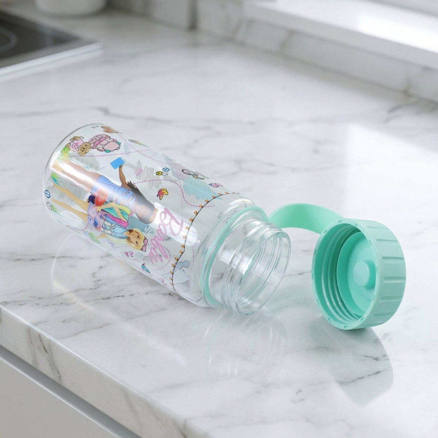 Kids water bottle hanging on strap for portability