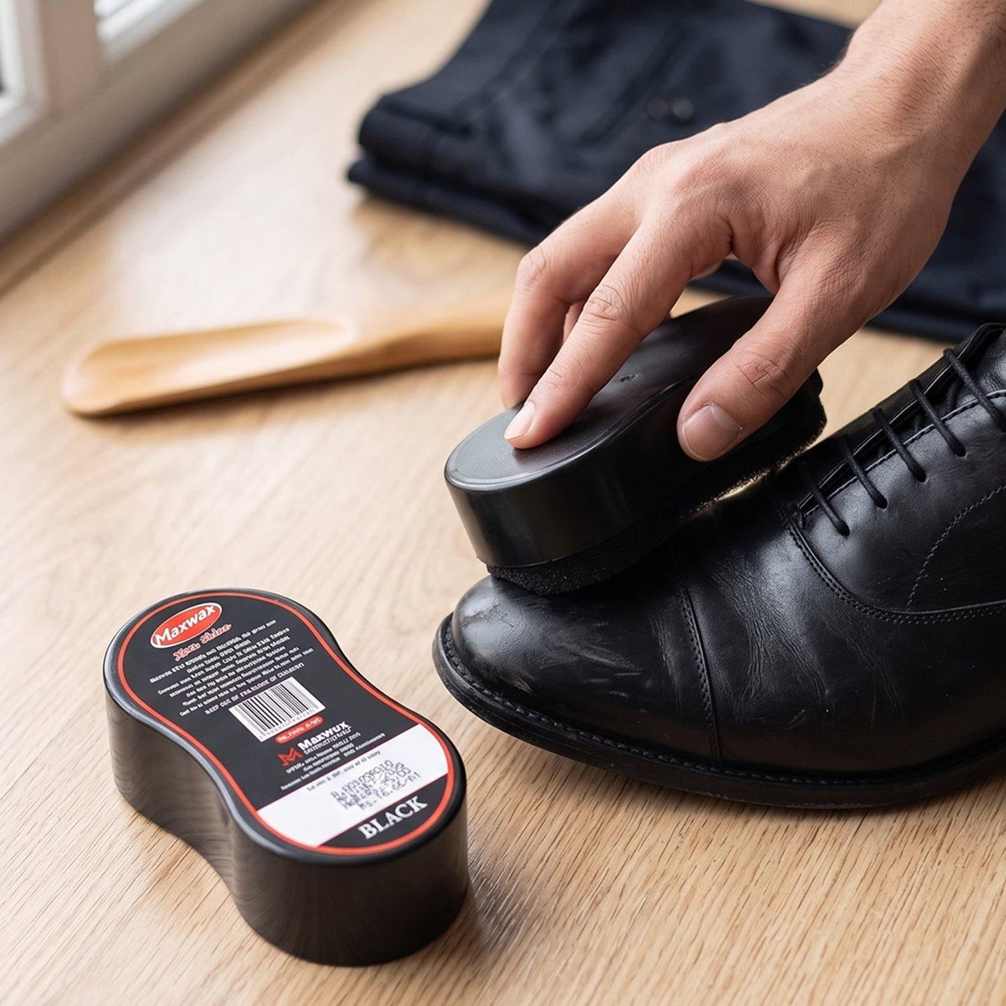 Black shine shoe polish with sponge applicator