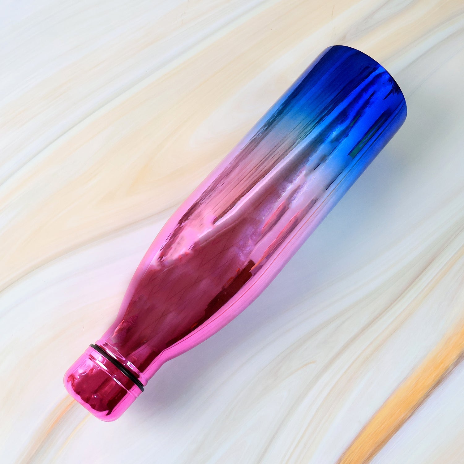 Close-up of stainless steel water bottle with gradient finish