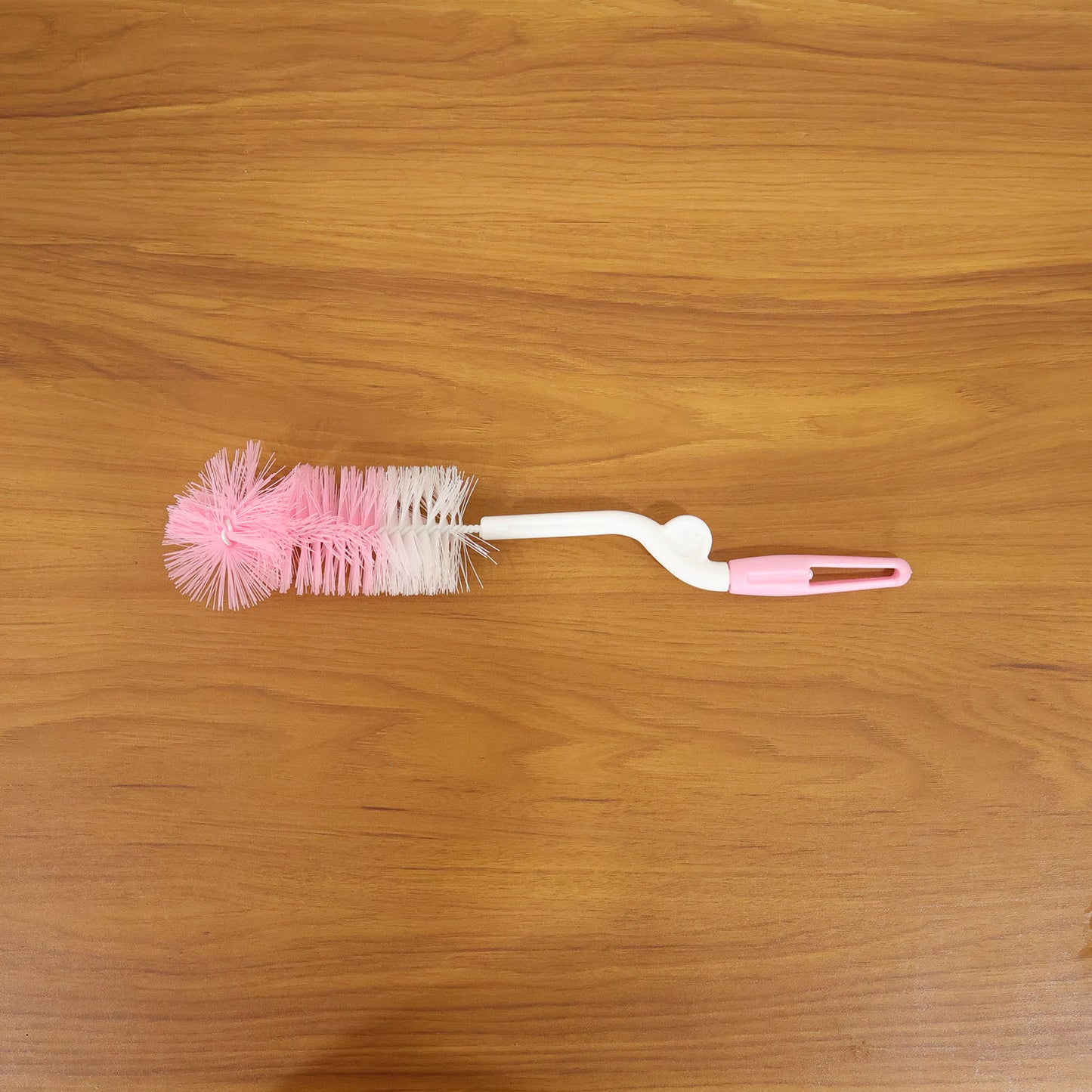 Bottle cleaning brush in use with 360 degree rotary handle