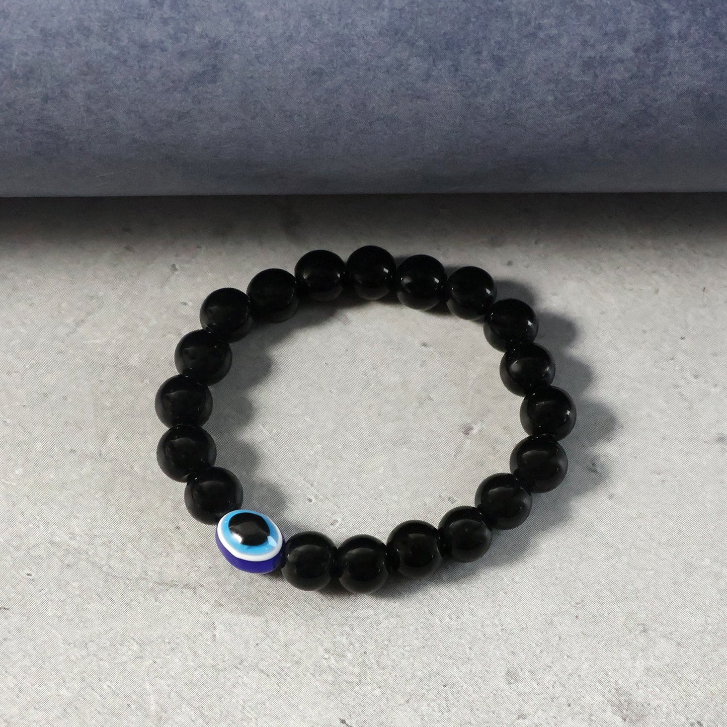 Close-up detail of elegant dual-tone beads on beaded stretch bracelet