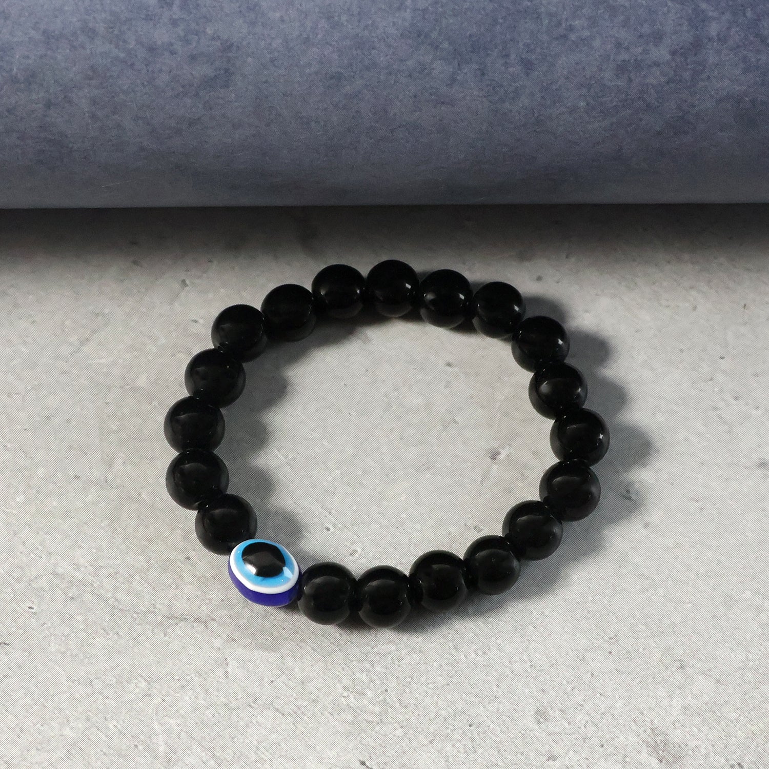 Close-up detail of elegant dual-tone beads on beaded stretch bracelet
