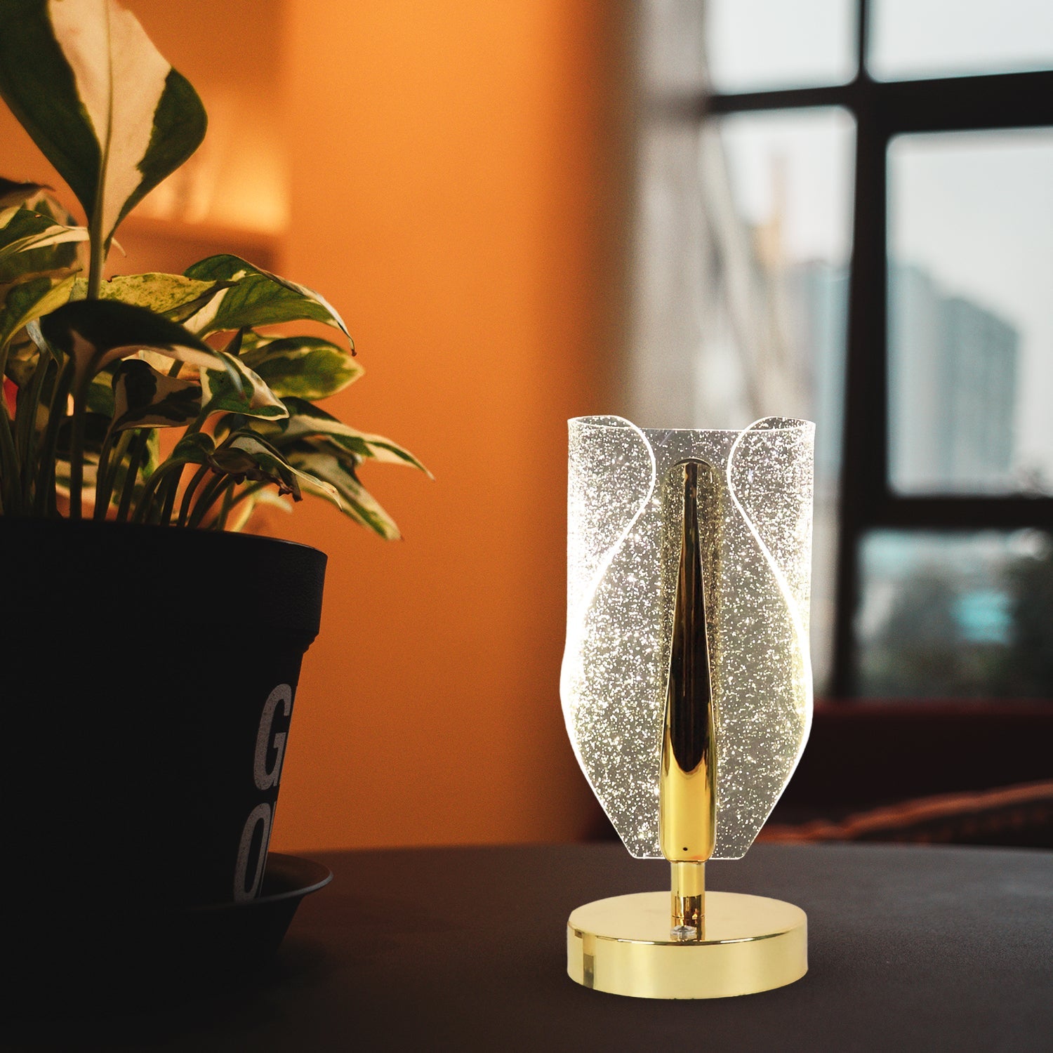 Crystal-cut LED table lamp with metallic base for home décor