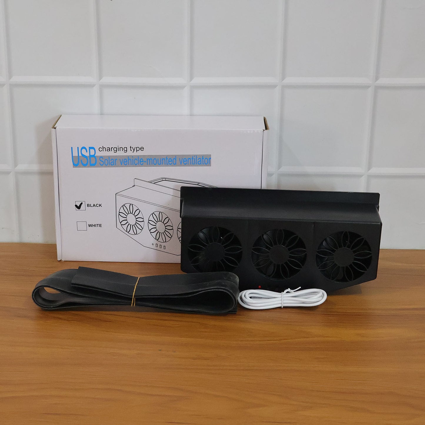 Triple fan car window exhaust ventilator installed for sun-exposed parking