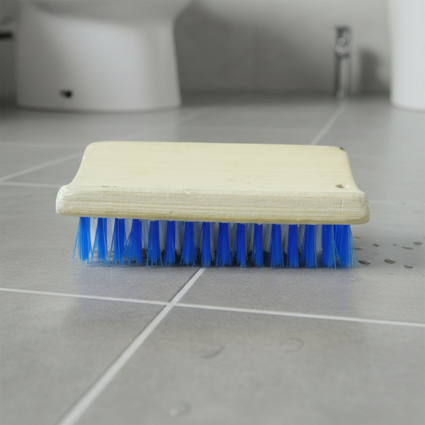 Hard bristle cleaning brush designed for tough stains on floors and clothing