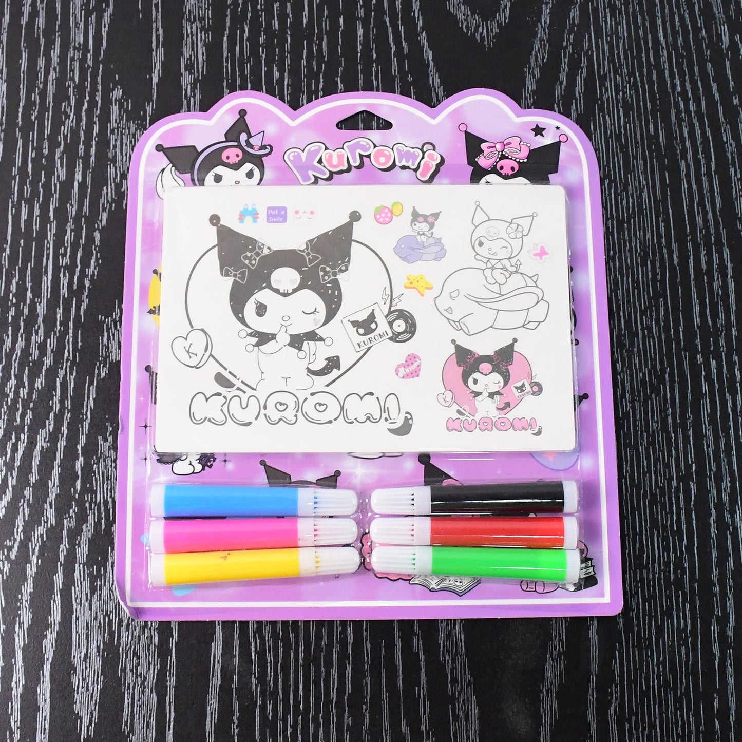 Child enjoying creative coloring activity with Kuromi coloring set