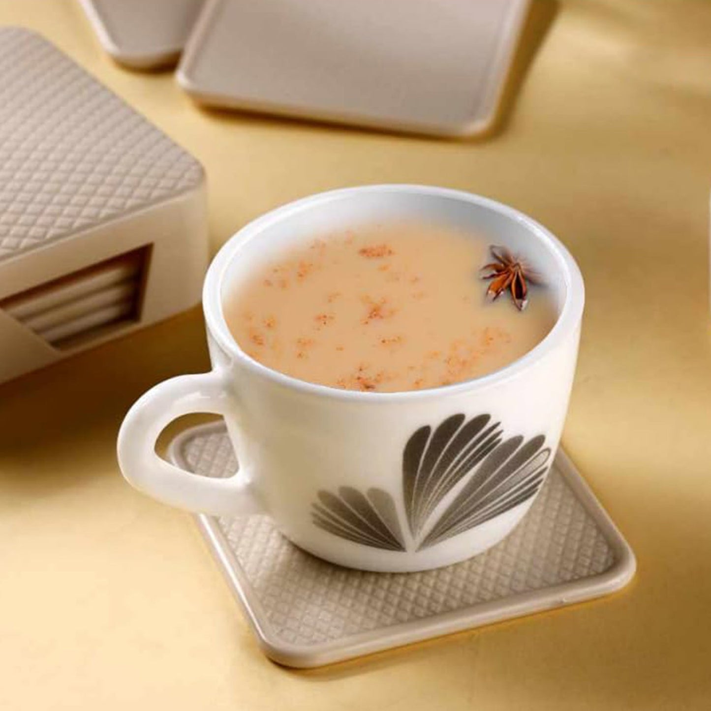 Ganesh branded heat-resistant coasters set shown for home and office use