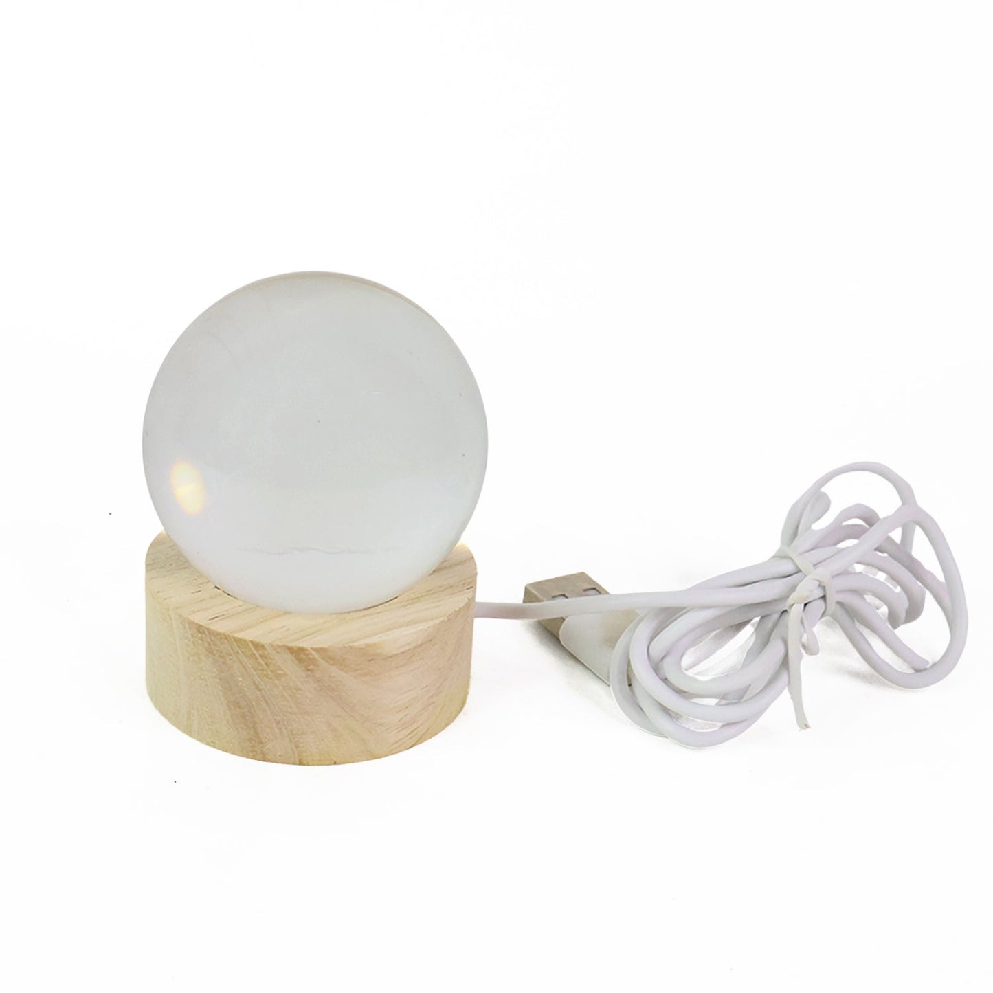 Ganpati 3D Crystal Ball Lamp beautifully lit in a cozy room, creating a warm night light ambiance.