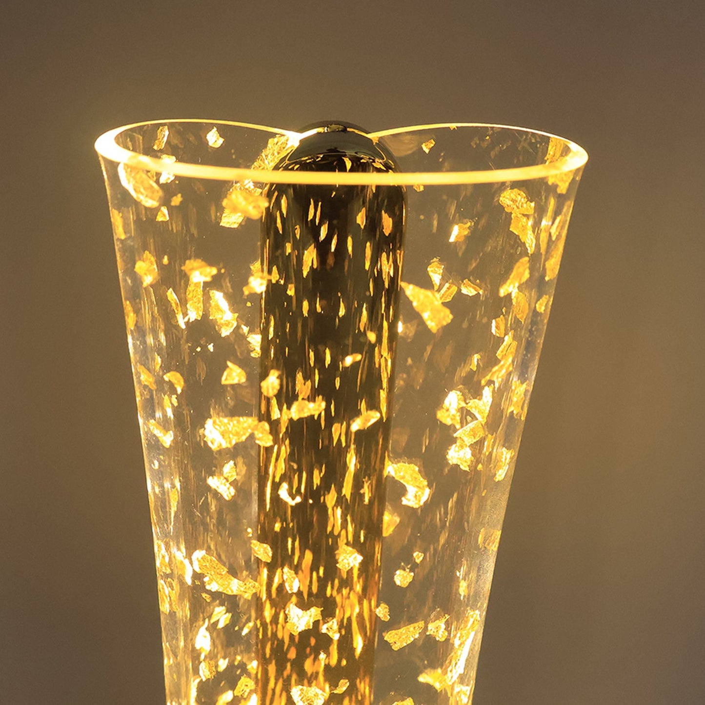 Decorative crystal-effect acrylic table lamp with golden base on desk