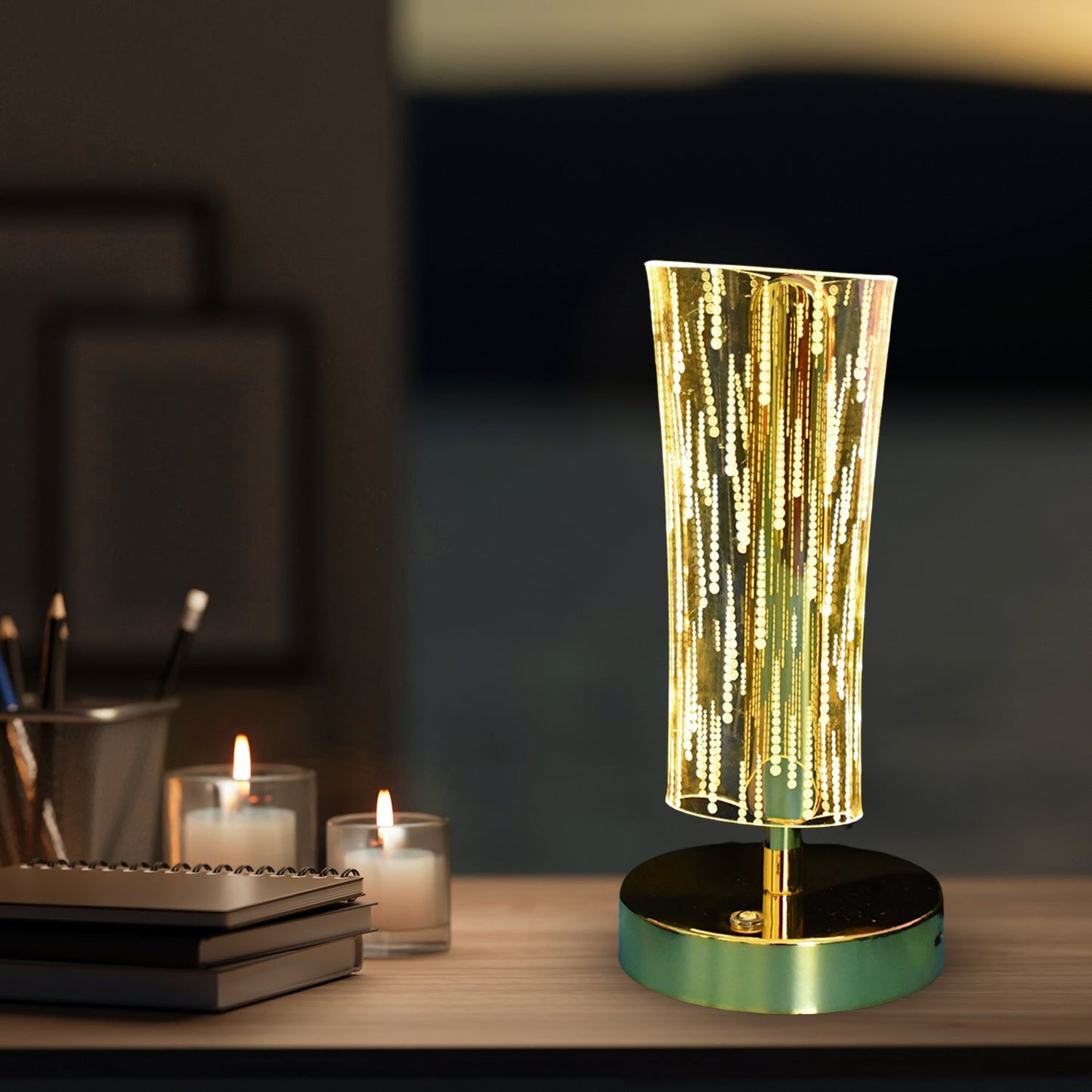 Close-up of crystal table lamp showing detailed LED light effect and golden base