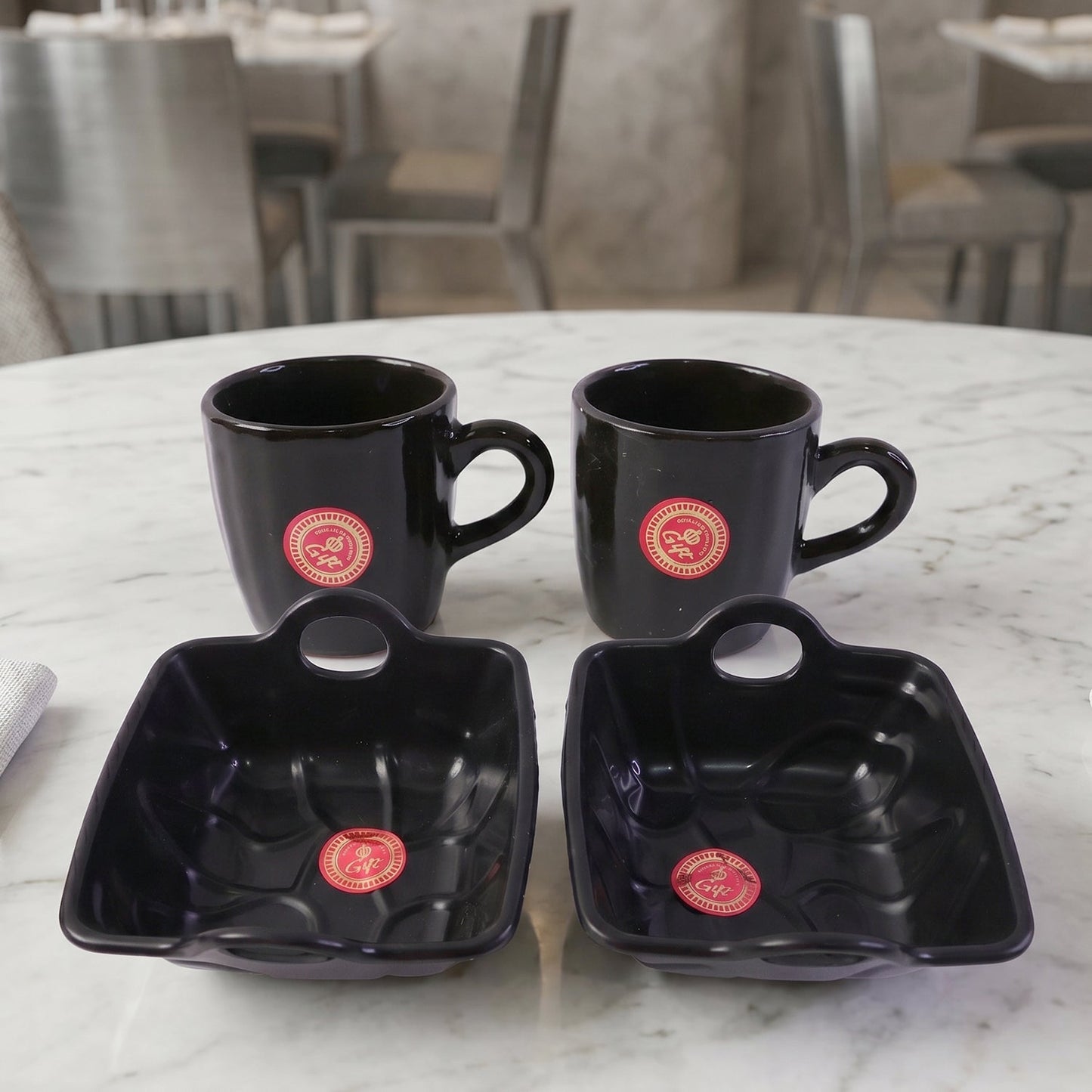 An individual Play Station ceramic coffee mug from the 4-piece set, highlighting its comfortable handle.