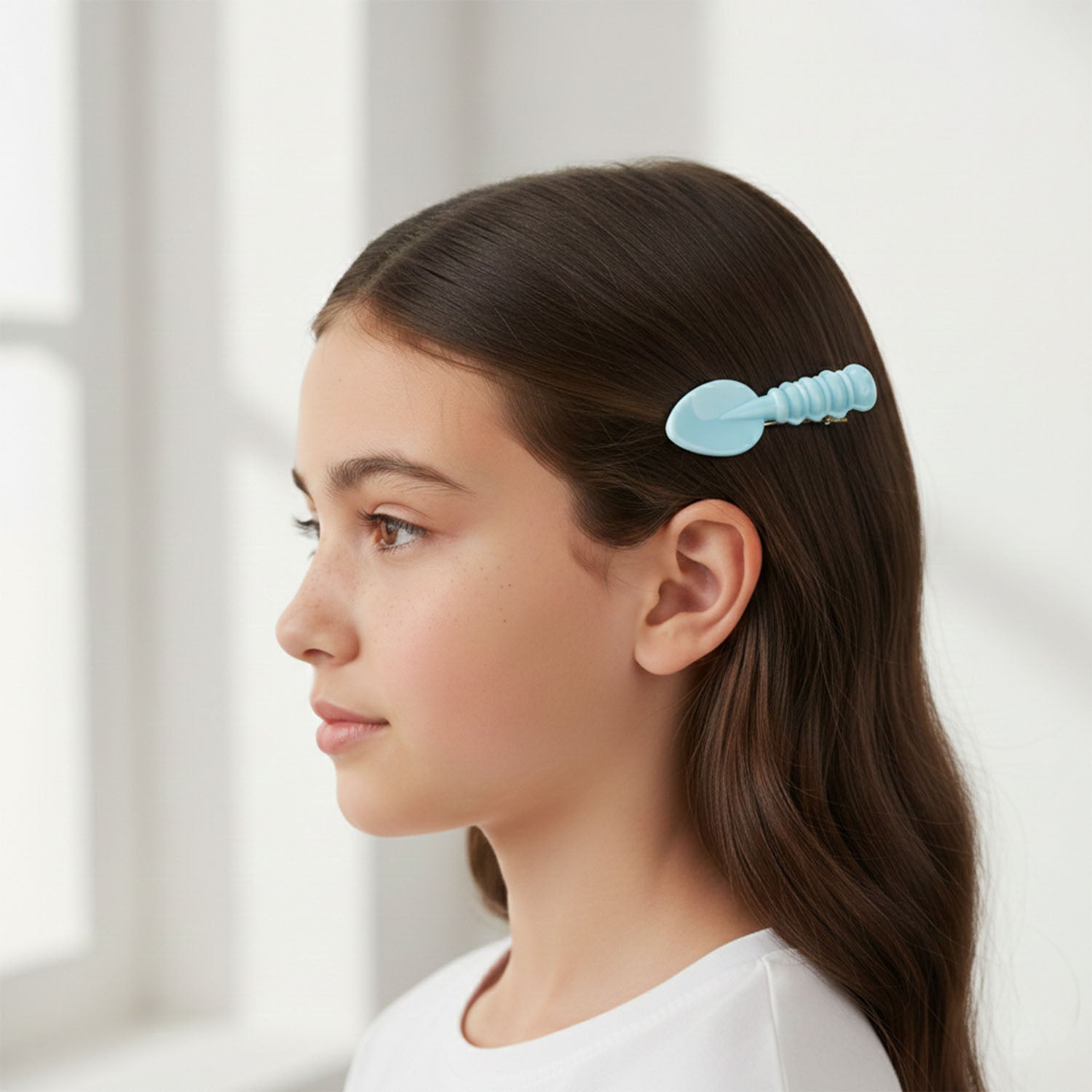 Side view of spoon and spatula shaped hair pins for daily wear