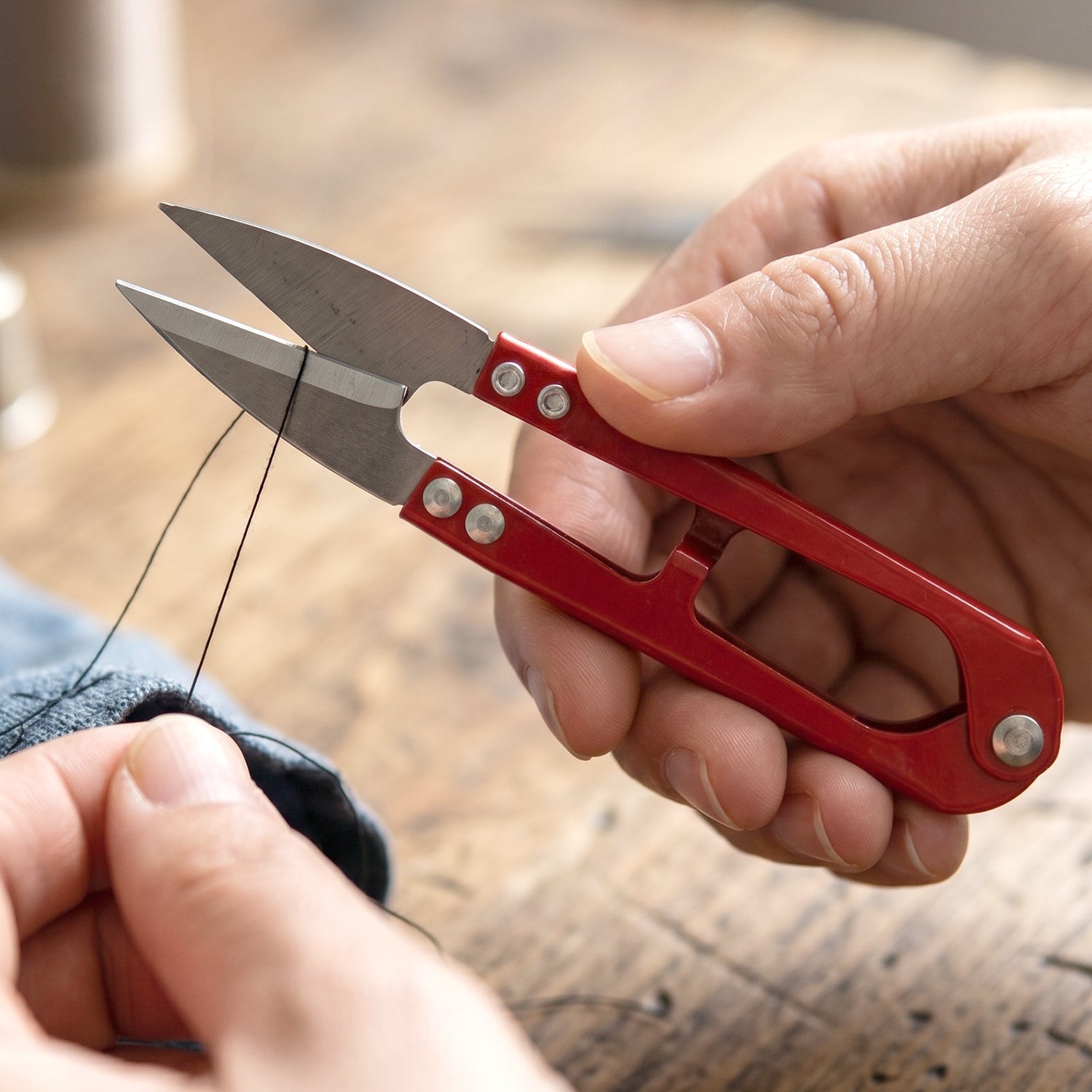 Handheld snip scissors ideal for sewing, crafting, and fabric trimming