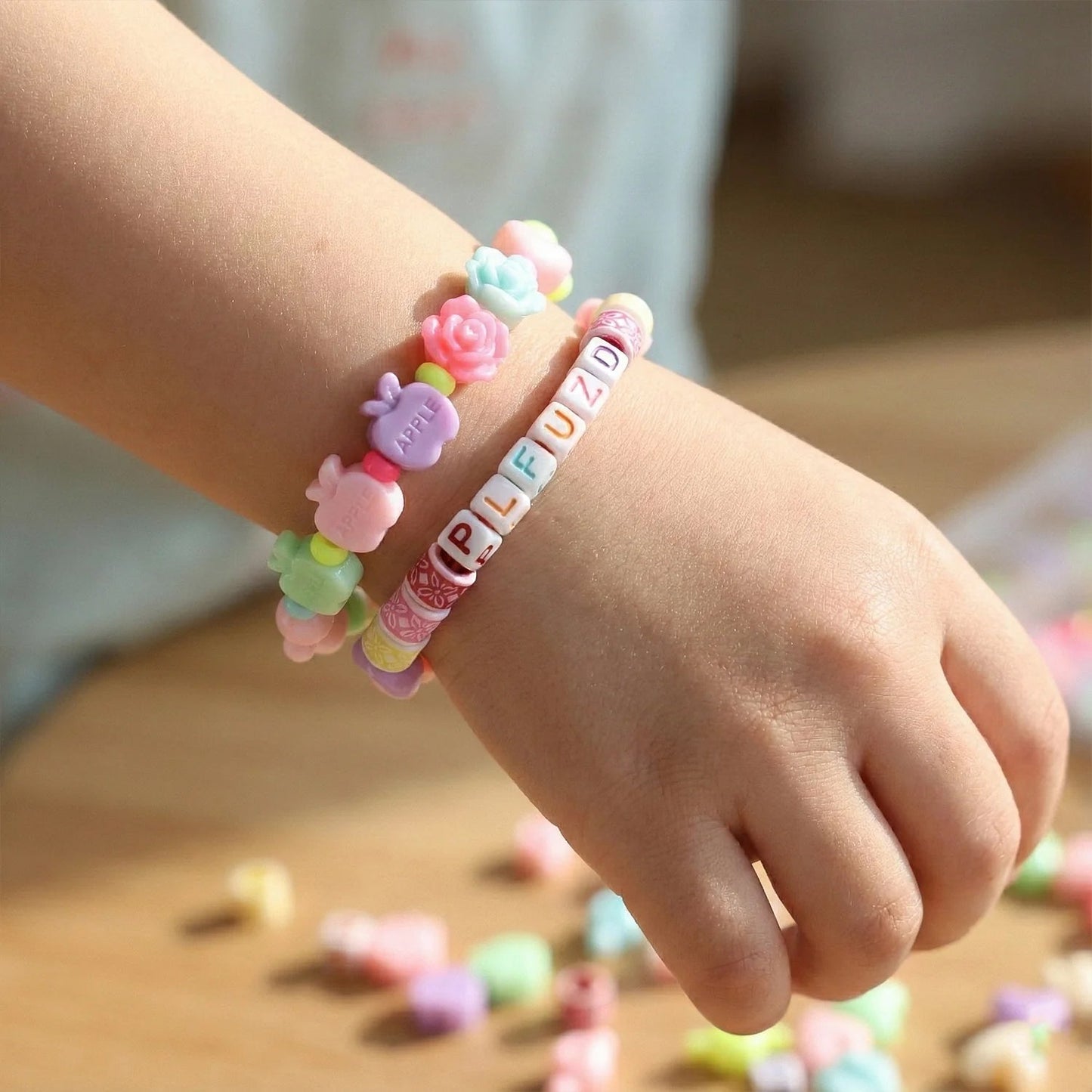 Kids beads DIY set showing colorful plastic beads and string for bracelet and necklace crafting