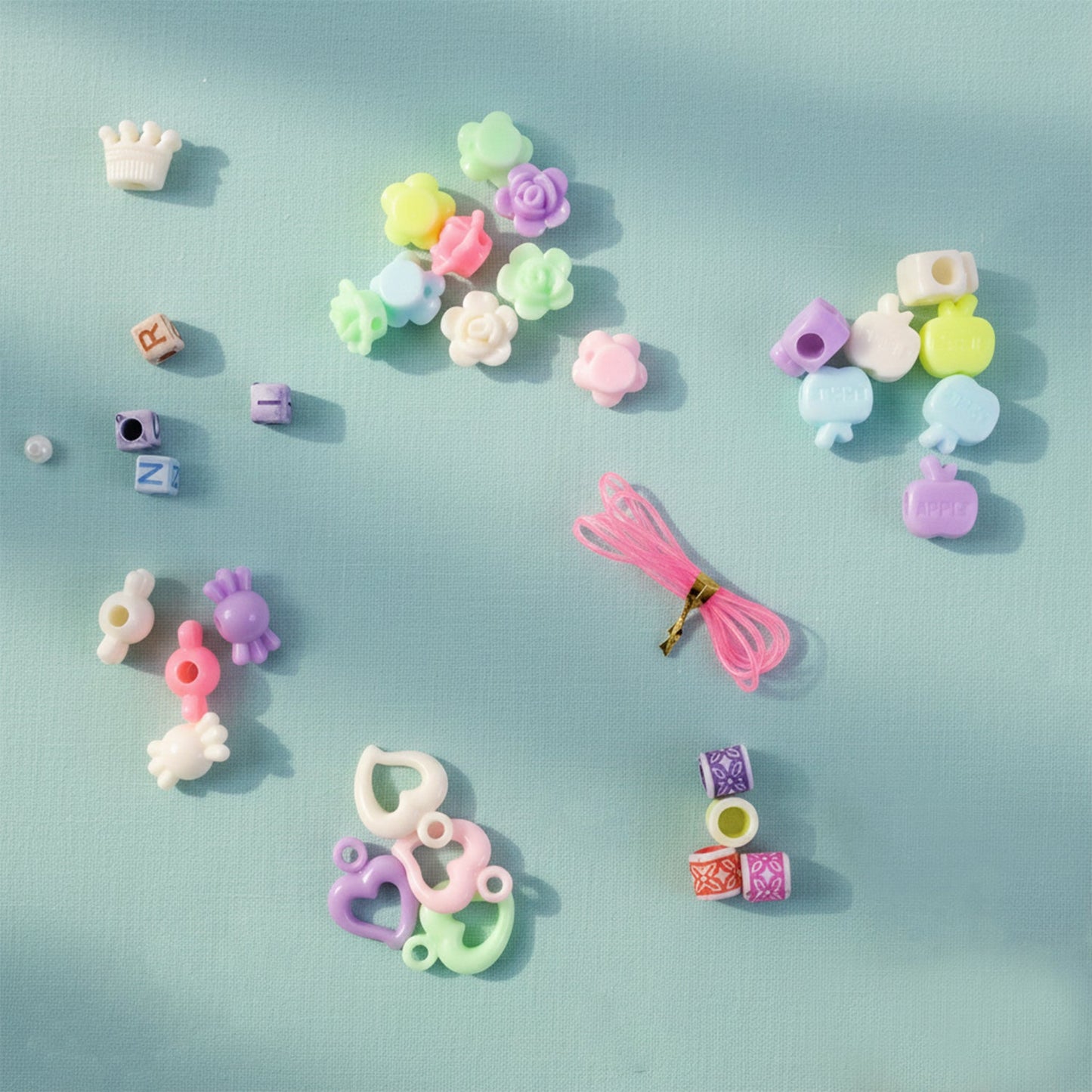 Jewellery making kit for kids featuring vibrant beads and flexible string in tray